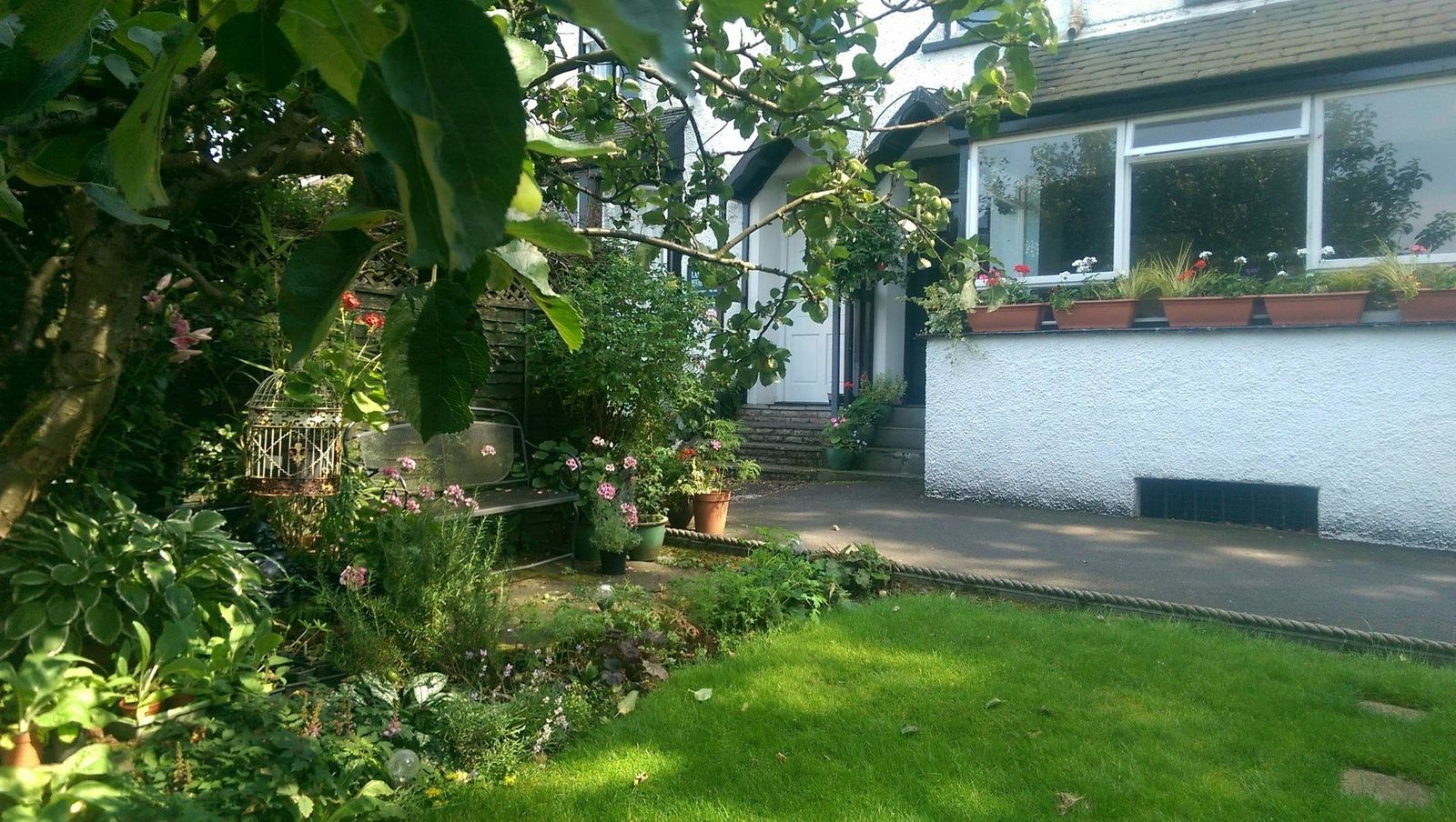 Front garden with bench and window boxes